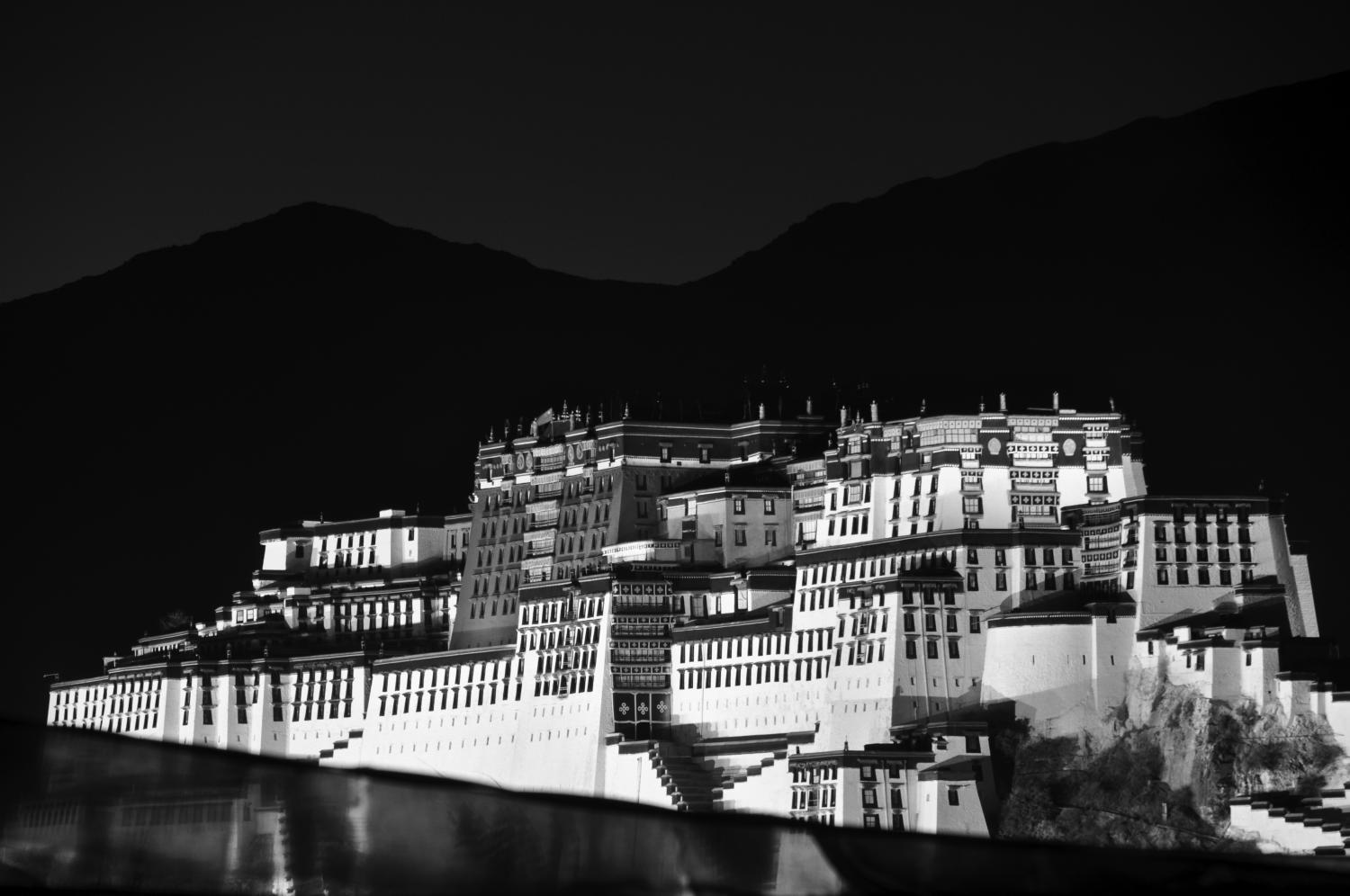 In+Lhasa%2C+the+capital+of+Tibet%2C+the+Potala+Palace+stands+as+a+monument+to+Tibetan+Buddhist+practices%2C+despite+the+current+Chinese+occupation+and+suppression+of+traditional+religion+and+culture.