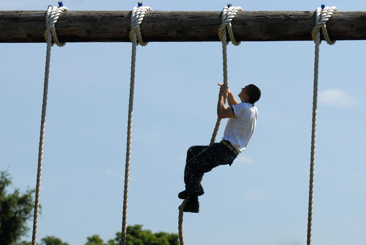 ANNAPOLIS, Md. (July 12, 2011) A Plebe in the U.S. Naval Academy Class of 2015 makes his way through the schools obstacle course. (U.S. Navy photo by Mass Communication Specialist 1st Class Chad Runge/Released)
