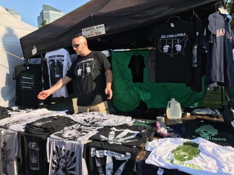 A man selling t-shirts.