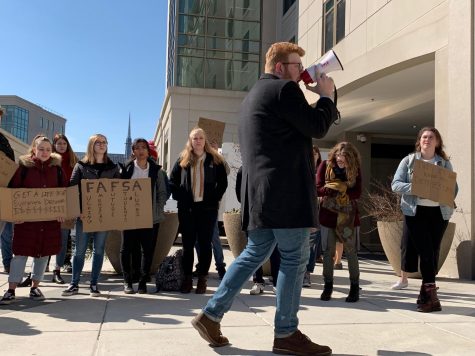 Mitchell Lenneville rallies protestors in front Constitution Hall on Thursday.