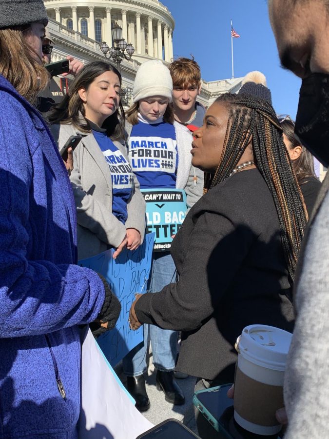 Cori Bush speaks with the protesters, including several March for Our Lives activists who joined the sit-in, on the Capitol steps Nov. 19.