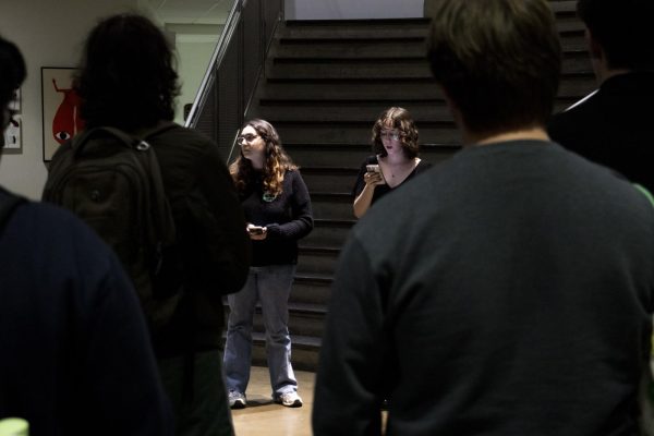 Shayna Caruso, left, and Gabriela Rupp read written remarks to a crowd of 40 students in the Katzen rotunda. 20 more audience members watched on Zoom.