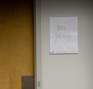 A handwritten sign outside the bathrooms in the Battelle-Tompkins building.
