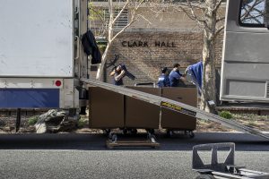Movers remove furniture from First-Year Advising office building Clark Hall on March 31.