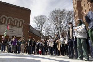 Protestors listen to a student speaker outside of the Leo J. O’Donovan Dining Hall.